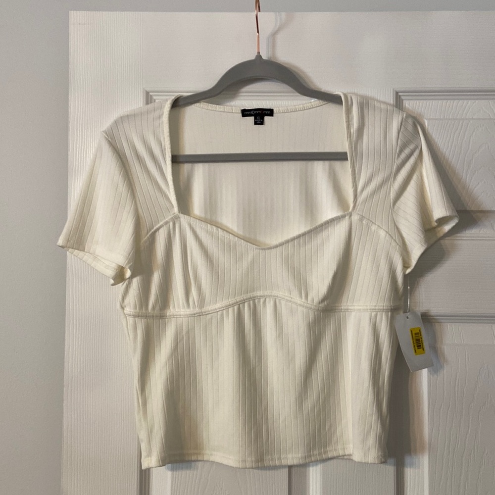 Mmmm Ivory shirt brand new with tags length 19” bust 34”